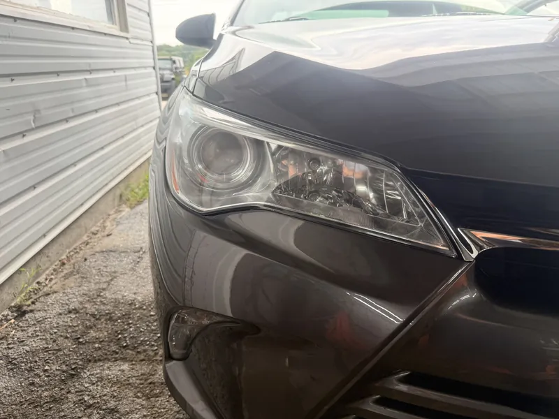 The same headlight after restoration, the lens clear with the projector visible inside