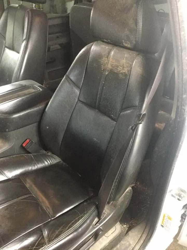 Black pickup-truck interior - deep-clean detail (front leather seat) - before