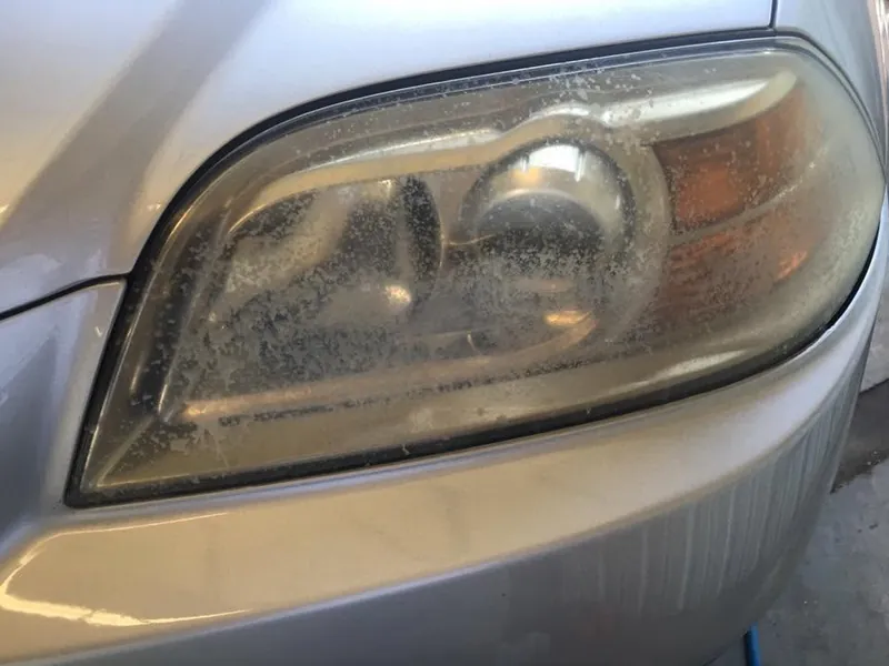 Gold car - headlight restoration - before