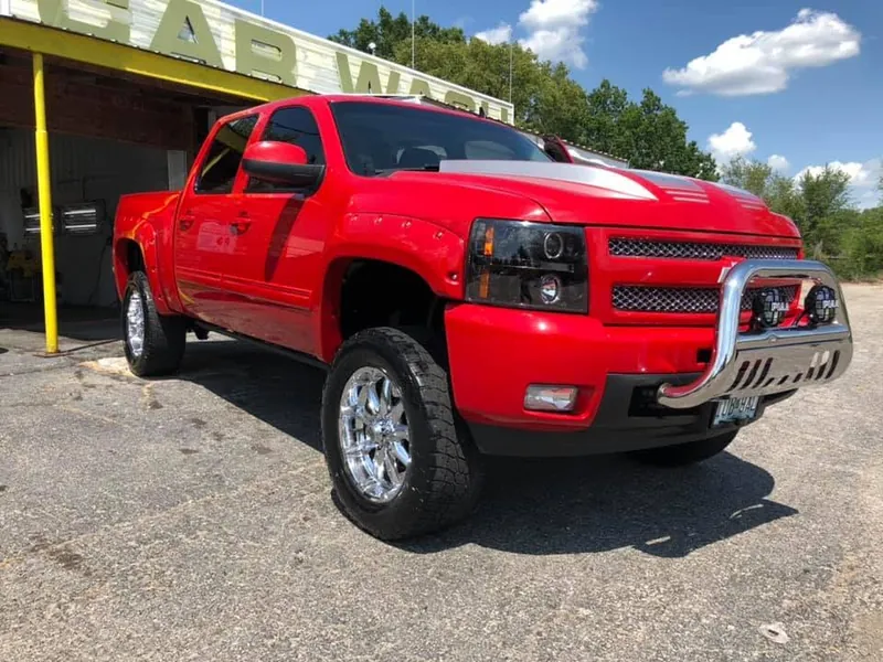 Red lifted pickup truck - exterior after detailing