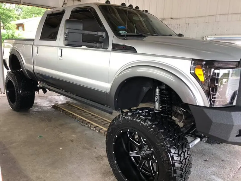 Silver lifted pickup truck - exterior after detailing
