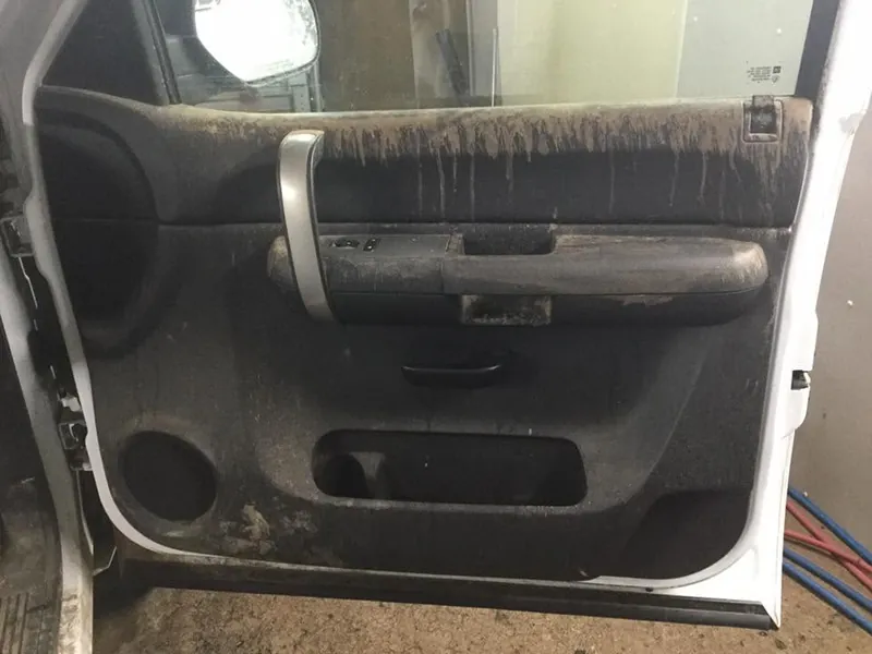 Gray pickup-truck interior - deep-clean detail (driver door panel) - before